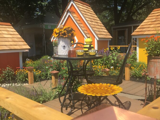A landscaped urban patio in yellow celebrates small spaces at the philadelphia flower show.
