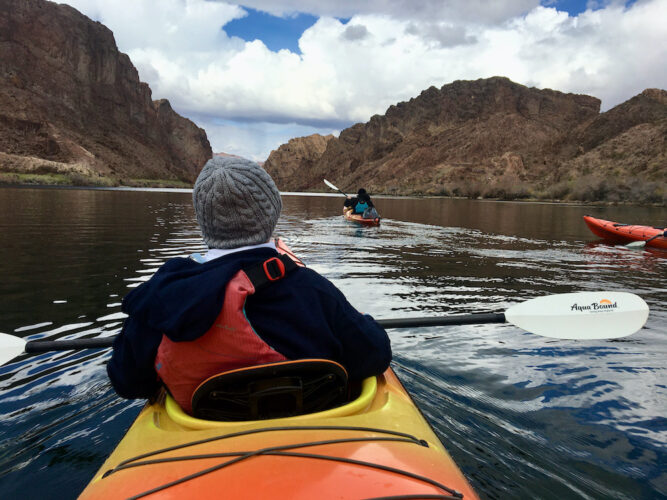 A kayaker paddles upstream on the colorado river