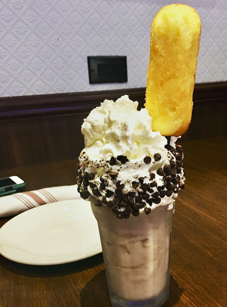 A shake at the royal brittania pub at the venetian hotel comes with a twinkie on the straw, chocolate chips around the rim and a pile of whipped cream