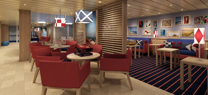 Here's Why A Family Cruise Should Be In Your Summer Vacation Plans carnival's family harbor lounge has a red and blue nautical theme, comfortale chairs and couches and tables for snacking and playing games.