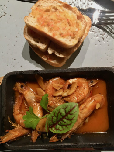 garlic shrimp and tomato toast at the don juan bar at the parador reosrt in costa rica.
