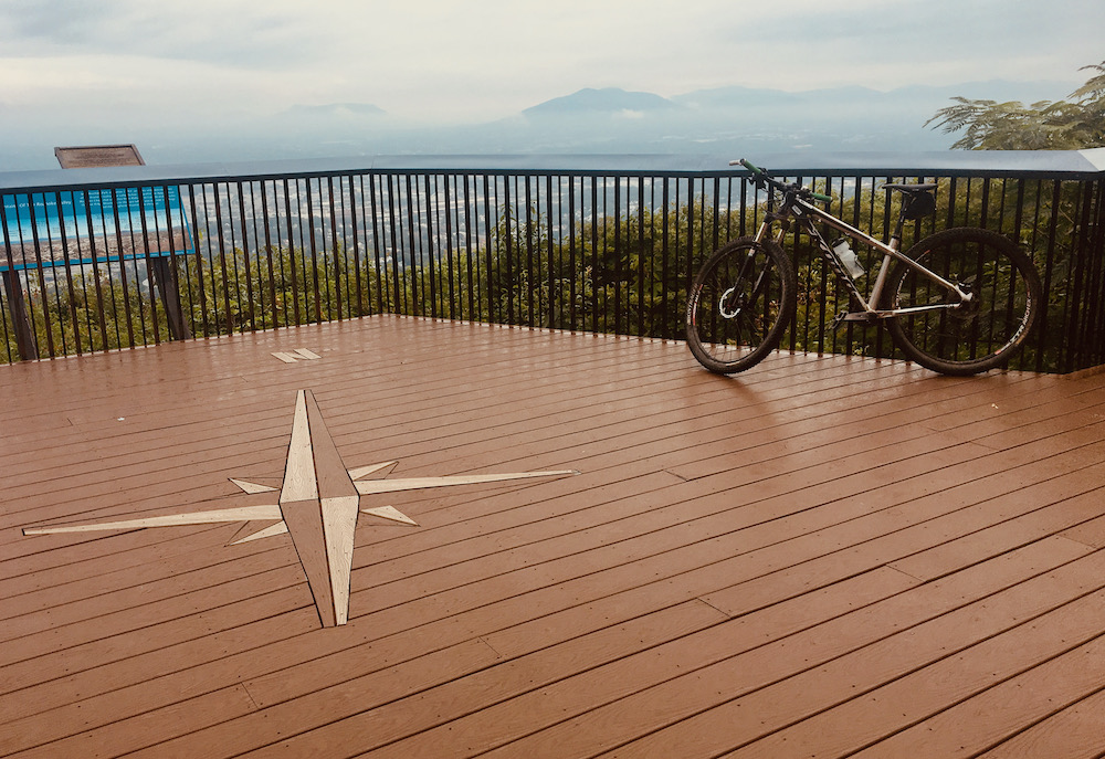 A mountain bike at the top of mill mountain with views or  the blue ridge mountains. This is one of the activities that make roanoke ideal for an outdoorsy mother-son weekend.