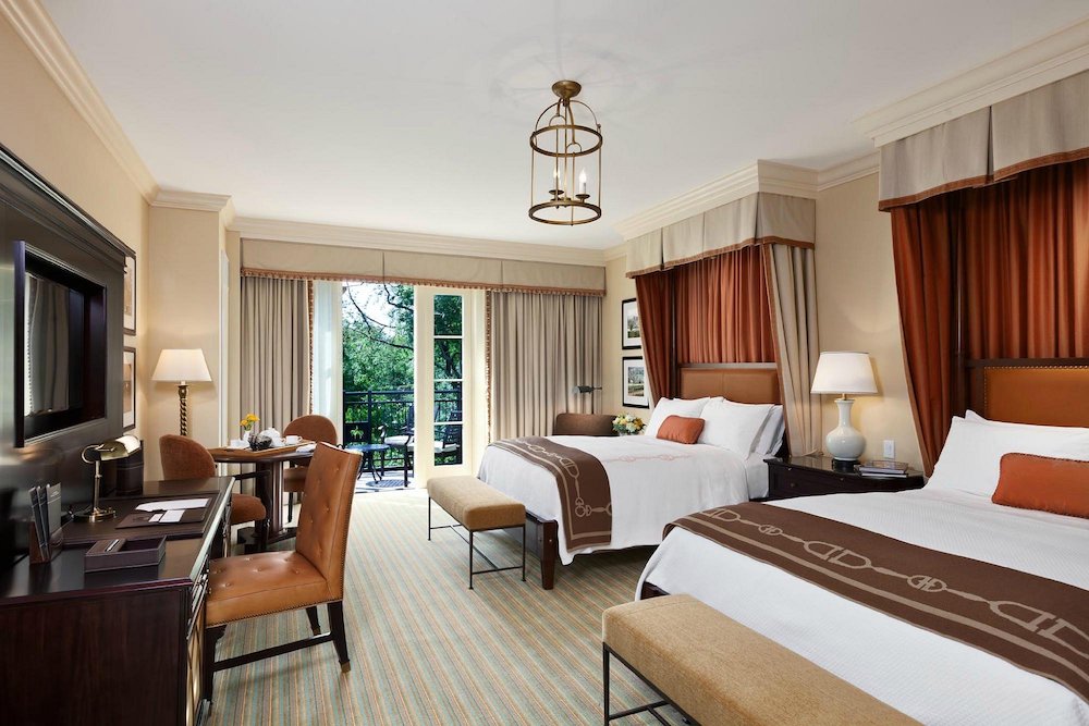 Double queen rooms at the salamander resort in virginia are spacious with private outdoor spaces and countryside views