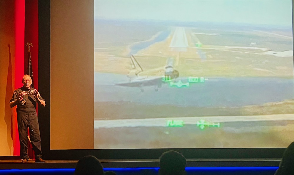 A space shuttle astronaut recounts his experiences in space during a talk at cape kennedy.