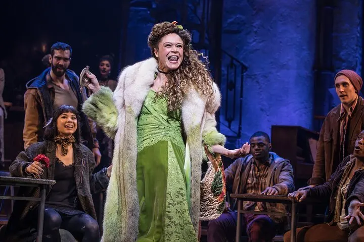 a happy persephone sings to the ensemble about the joys of springtime in hadestown, a broadway show nyc teens really like