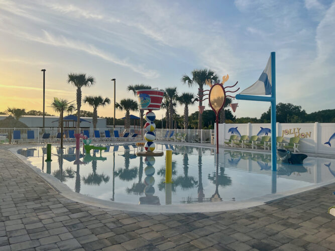 a colorful splash pad for kids at camp margaritaville in florida.