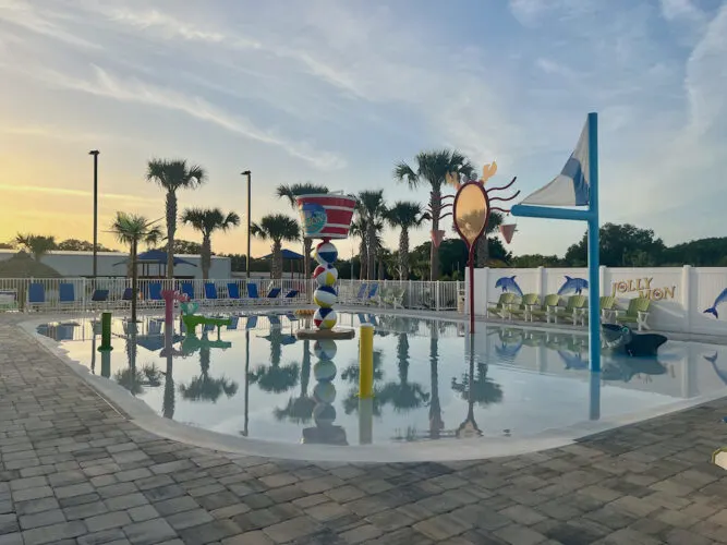 a colorful splash pad for kids at camp margaritaville in florida.