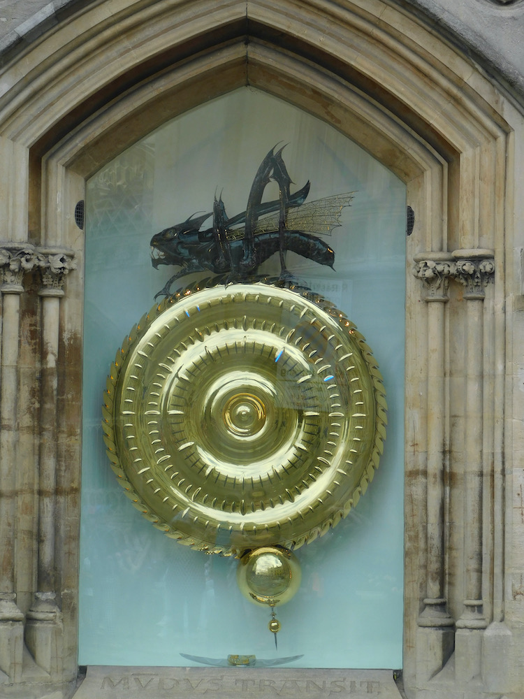 the corpus clock in cambridge is hard to miss with its chrono phage eating time atop a futuristic led face.