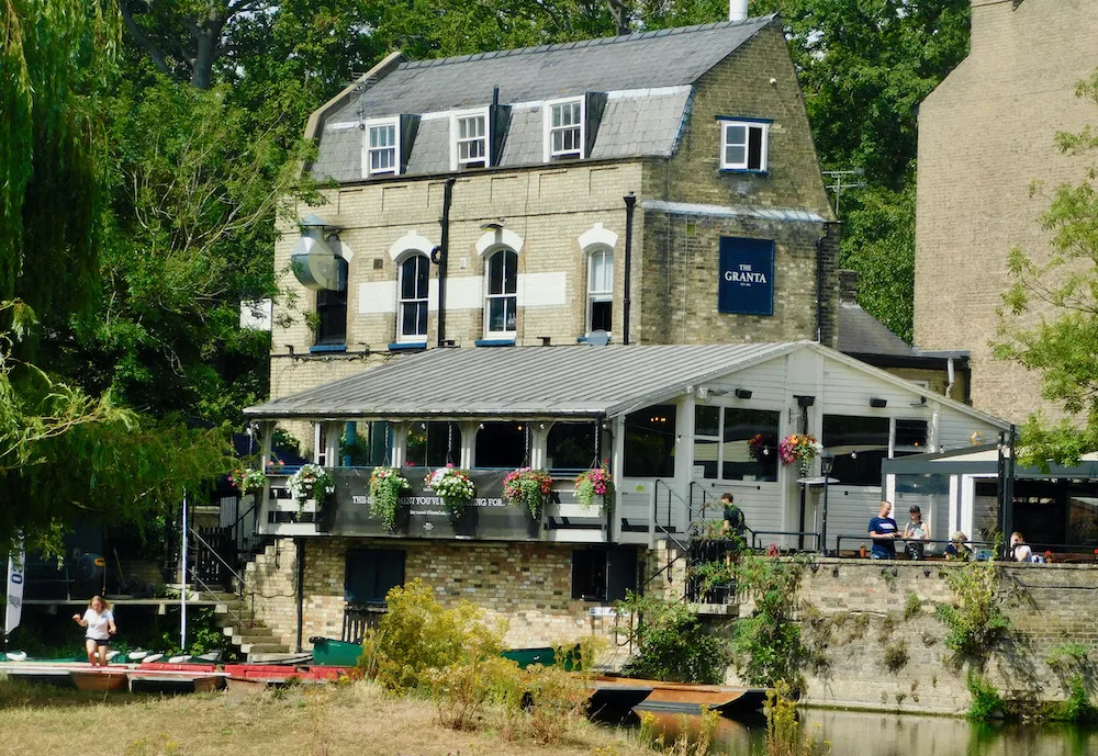 granta pub and punting dock sits on a quiet corner of the river in cambridge.