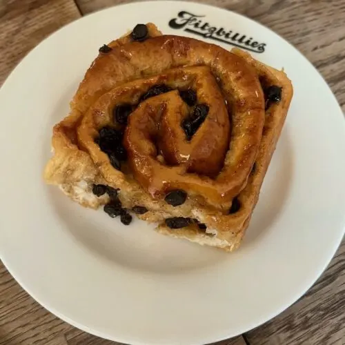 the famous chelsea buns at fitzbillie's tea room have raisins and a sweet glaze.