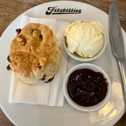 Traditional raisin scones come with clotted cream and raspberry jam at fitzbillie's tea room.