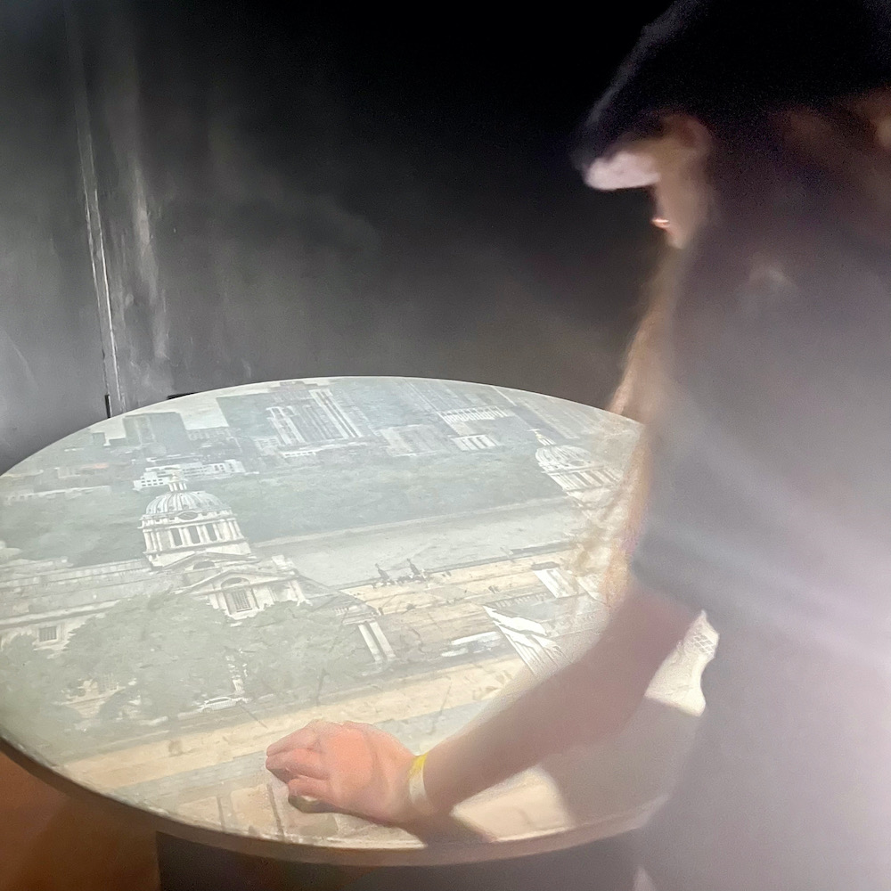 At the royal observatory in greenwich, the camera obscura gives a real-time view of the town below.