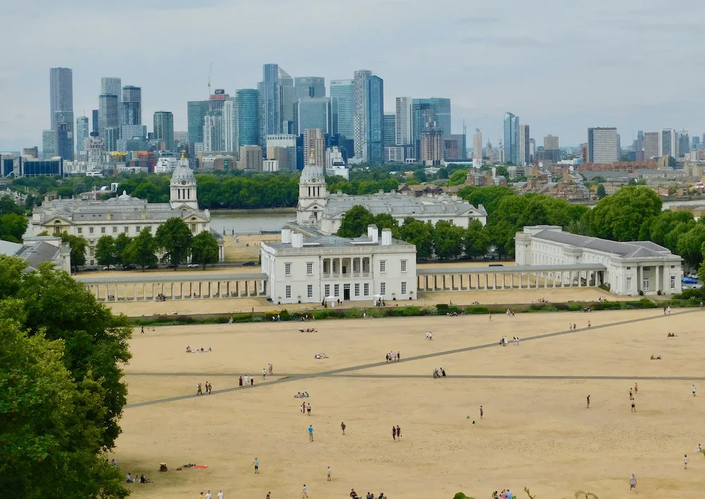 a view of greenwich, the thames and canary wharf from the royal observatory.