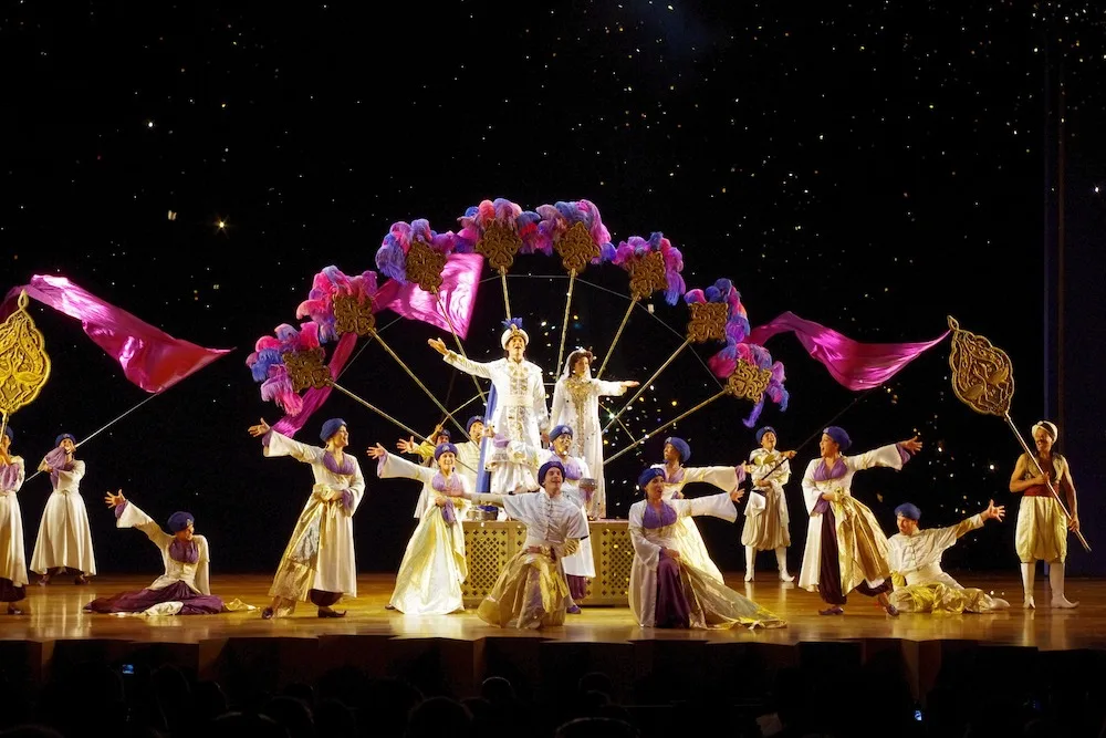13 Hot Broadway Shows Sure To Be A Hit With Your Teen one of the big production numbers in aladdin, featuring a cast with faux-middle-eastern costumes and giants fans made of feathers.