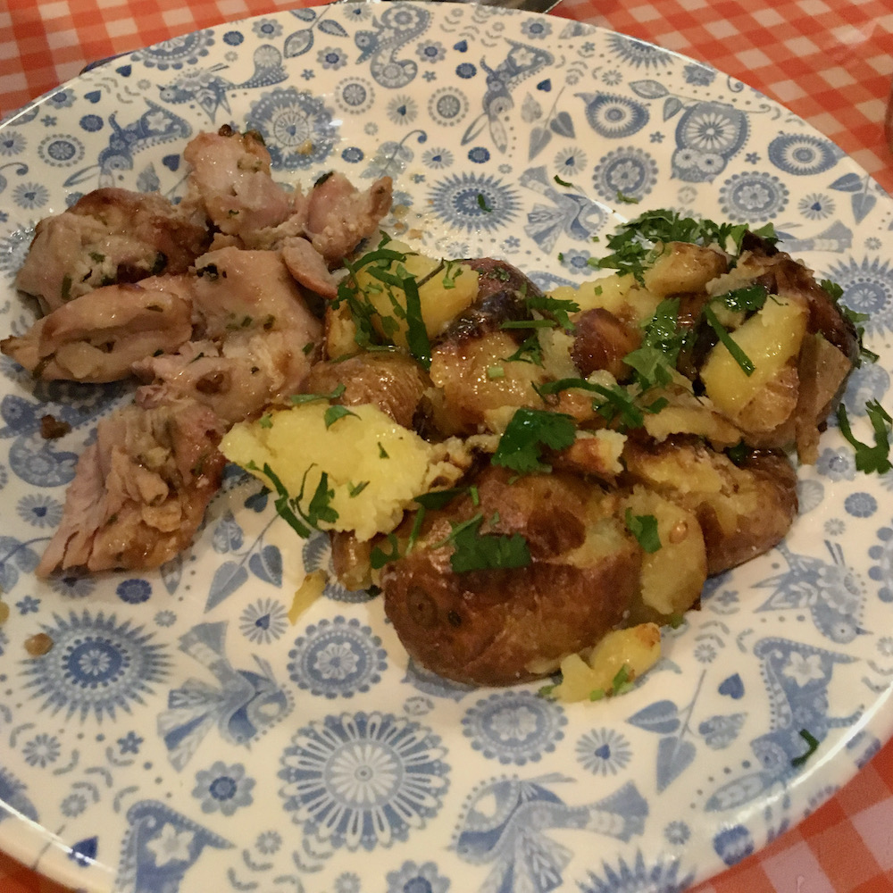 A kids meal at dishoom includes mildly spiced chicken and buttered potaoes.