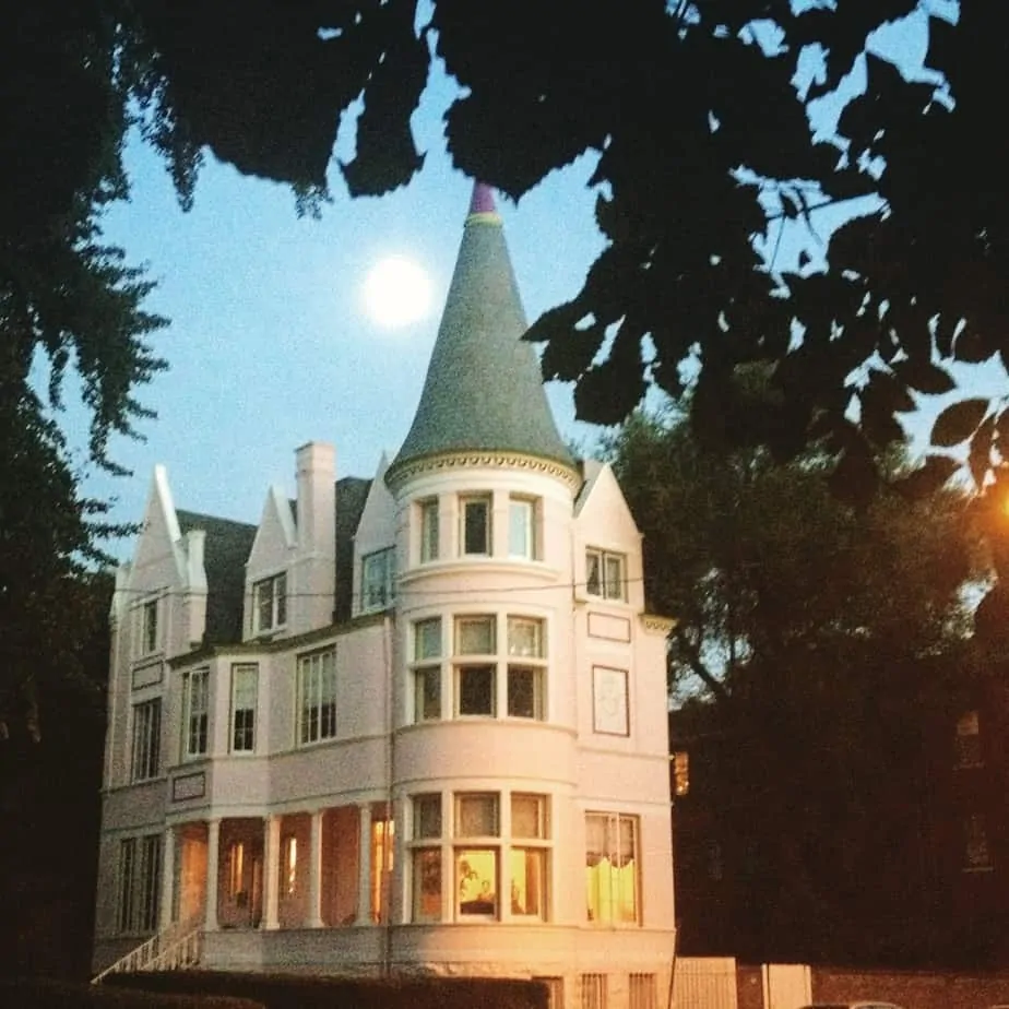 victorian mansios like this turretted one are the perfect backdrop for halloween-season ghost walks.