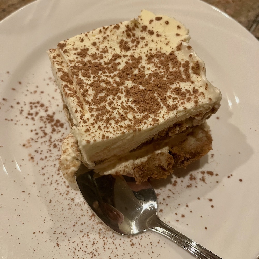 a perfect slice of classic tiramisu, dusted with chocolate at giorgio on pine. 