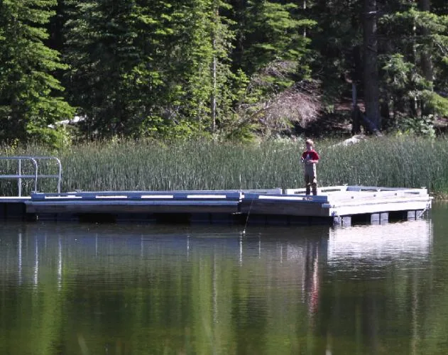 a boy fished on posey lake, near bryce canyon