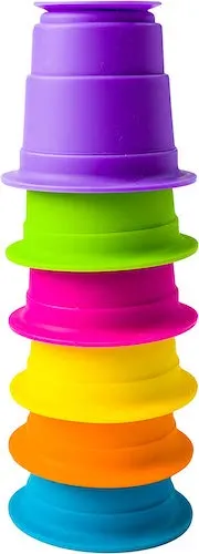 Gift Guide: 11 Top Travel Toys Your Kids Will Take Everywhere fat brain's suction kupz are the ideal travel toys because they are compact and can be played with in multiple ways.