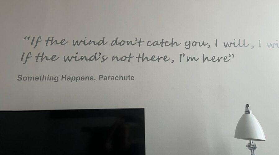 two lines from a something happens song, painted on a wall in a room at the morrison dublin hotel