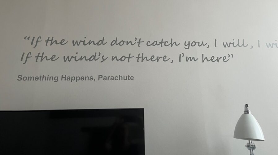 Two lines from a something happens song, painted on a wall in a room at the morrison dublin hotel