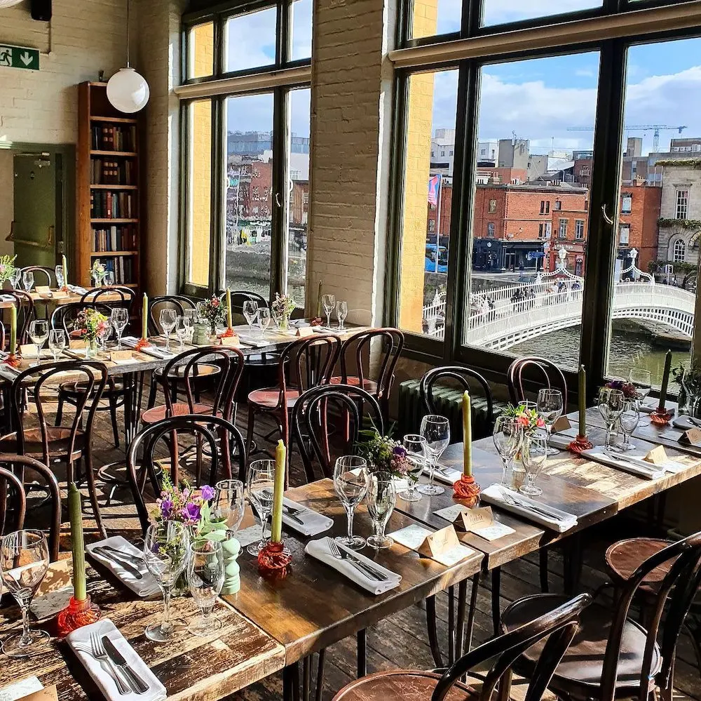 the winding stair restaurants has a cozy upstairs room with a gorgeous view of the liffey river.