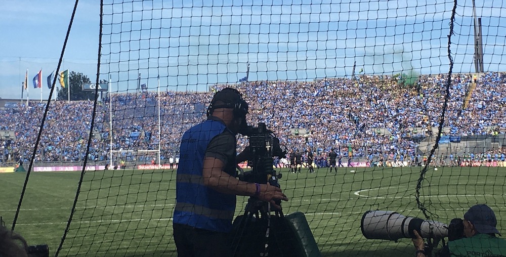 Dublin fans set off green smoke bombs on hill 16 in ireland's croke park while  cameramen and photographers keep giant cameras trained on the field.