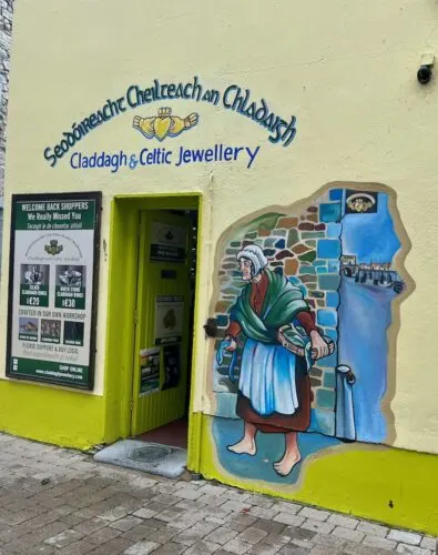 a jewelry shop with a mural of ann rish peaannt in galway, ireland