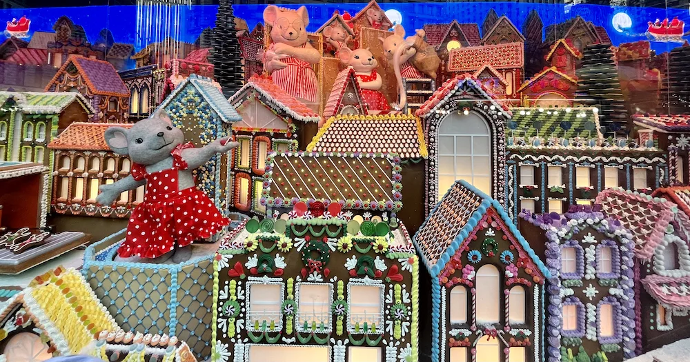 macy's chose animals celebrating the holidays in a candy-coated city for its 2022 holiday windows.