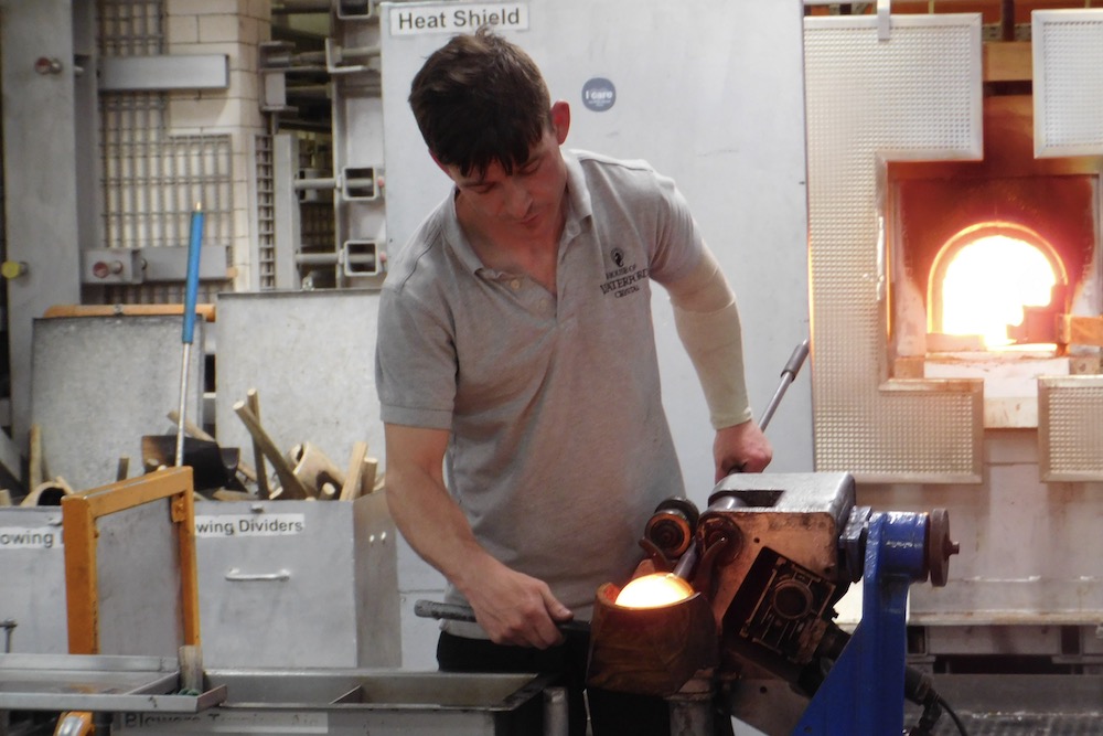 An expert glass blower begins a new project at the waterford crytal factory in southern ireland