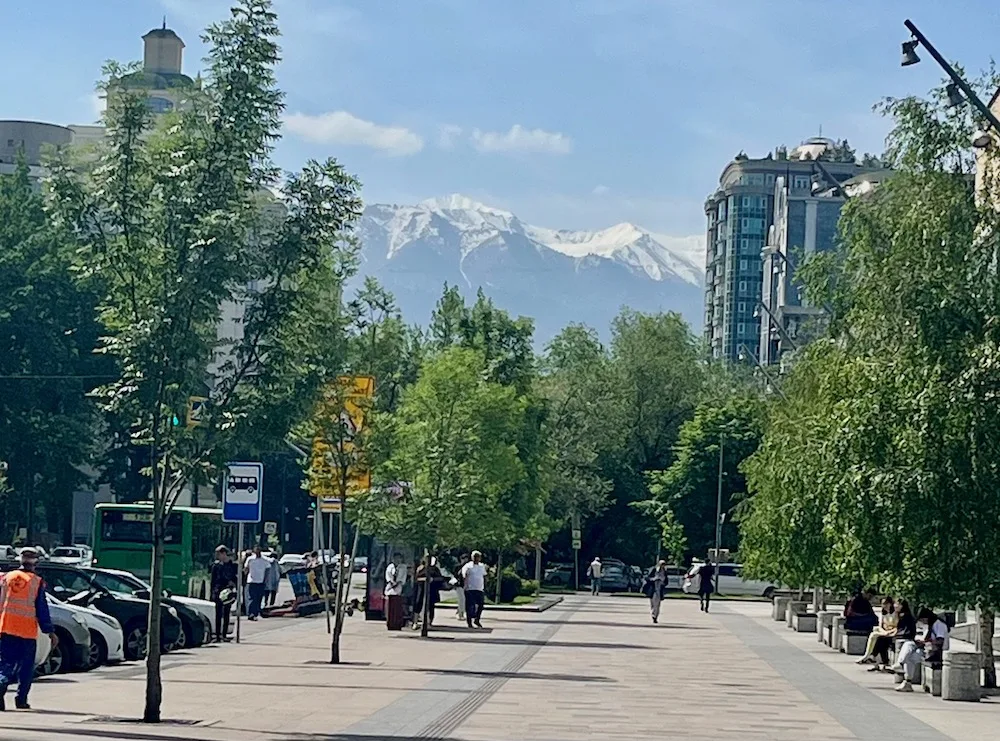 Travel To Kazakhstan With Kids? Yes! Here's All You Need To Know Almaty, kazakhstan is a modern city with wide, tree-line streets and mountains in the distance.