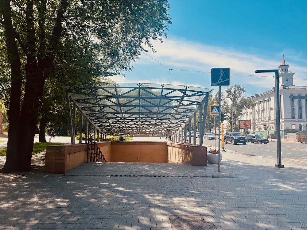 almaty is a city with wide avenues and sidewalks, nice architecture, trees and a modern subway.