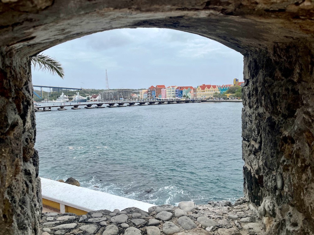 One of the most popular things to do in curacao is to visit the rif fort, where you and admire this view of punda and the queen emma bridge.