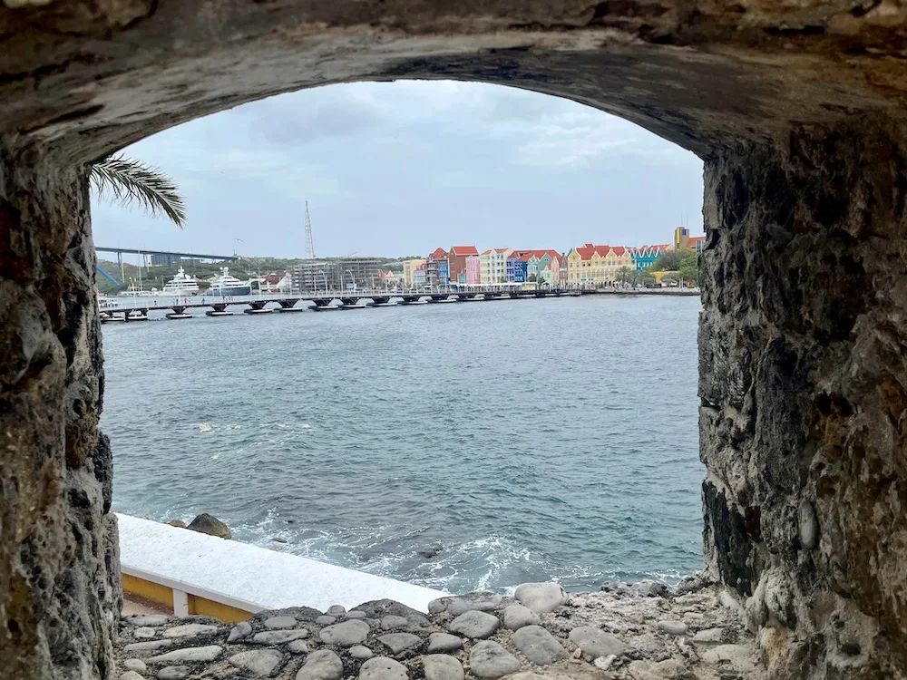 one of the most popular things to do in curacao is to visit the rif fort, where you and admire this view of punda and the queen emma bridge. 