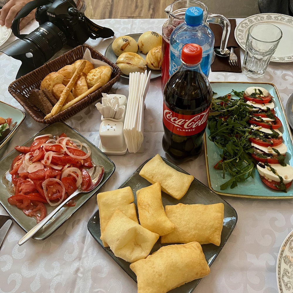 fruit juice, tomato salads, cheese, baursak, and chewy bagel-like bread are some vegetarian food options in kakakhstan.