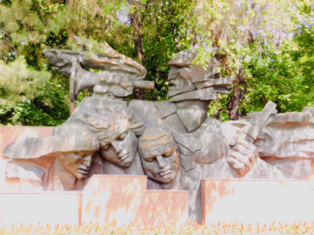 1 of several large, blockish, blunt statues in the war memorial in almaty's panfilov park.