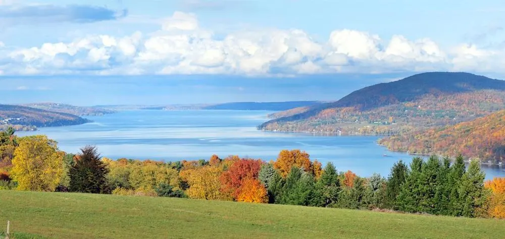 canandaigua lake in the finger lakes is surrounded by some of the best fall foliage on the east coast.