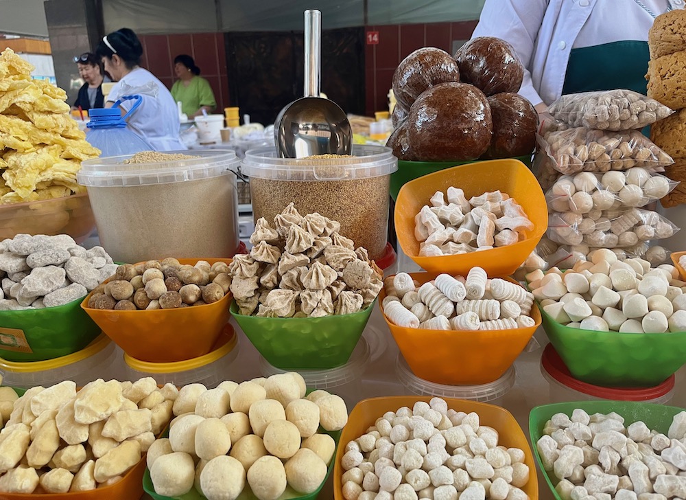 A market tall selling a variety of candy hand-made from cow and horse milk