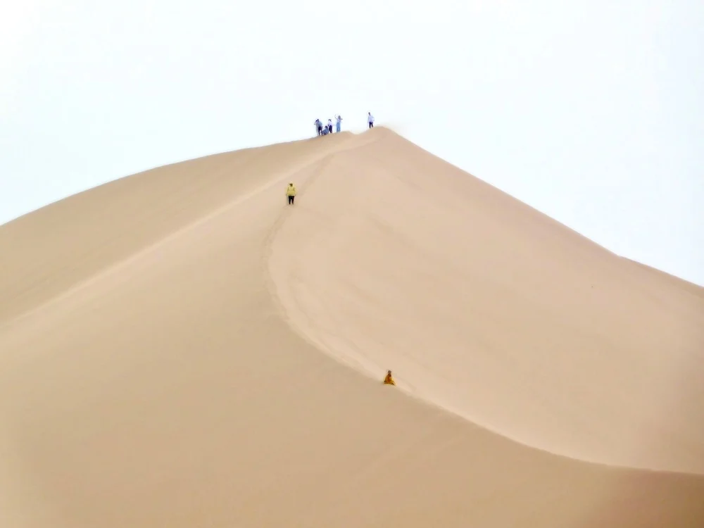 the singing dunes in altyn-emel nations park are a mystery and surprisingly tough to climb.