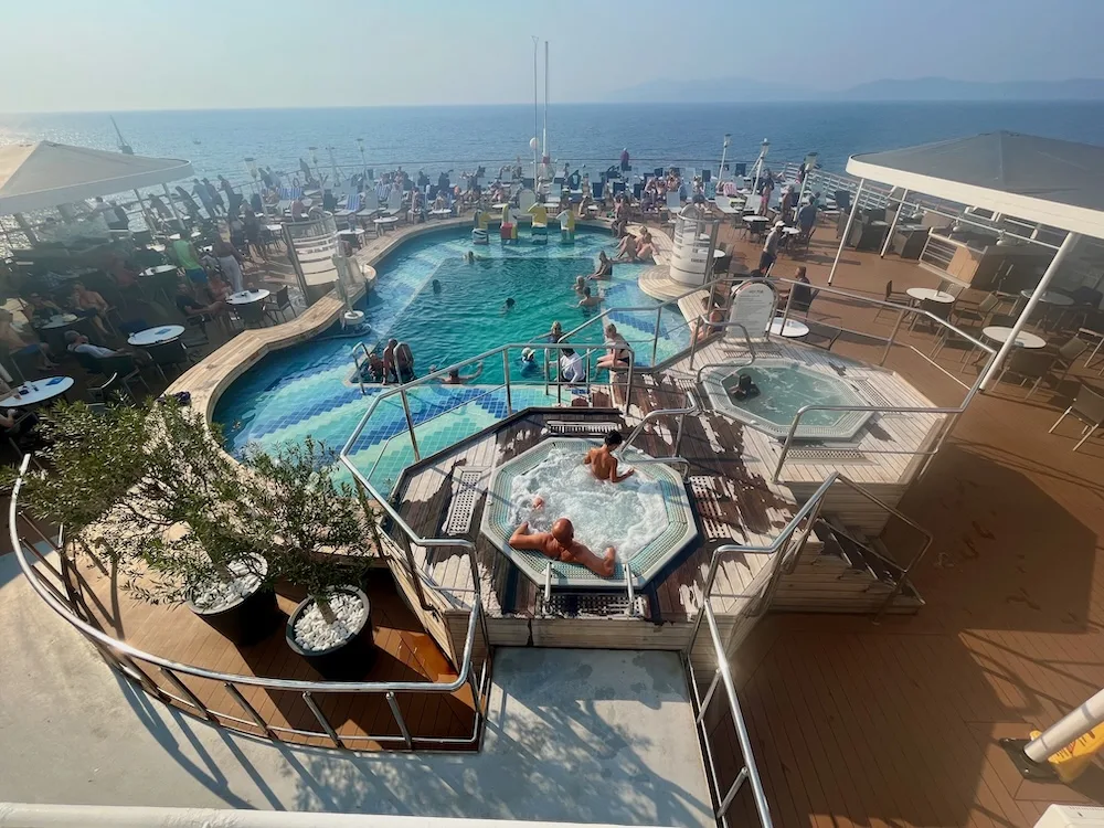 the h.a. oosterdam's adult pool has a view from back of the ship.
