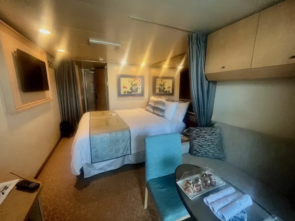 a typical balcony cabin on a holland american ship has a queen bed and pull-out couch. 