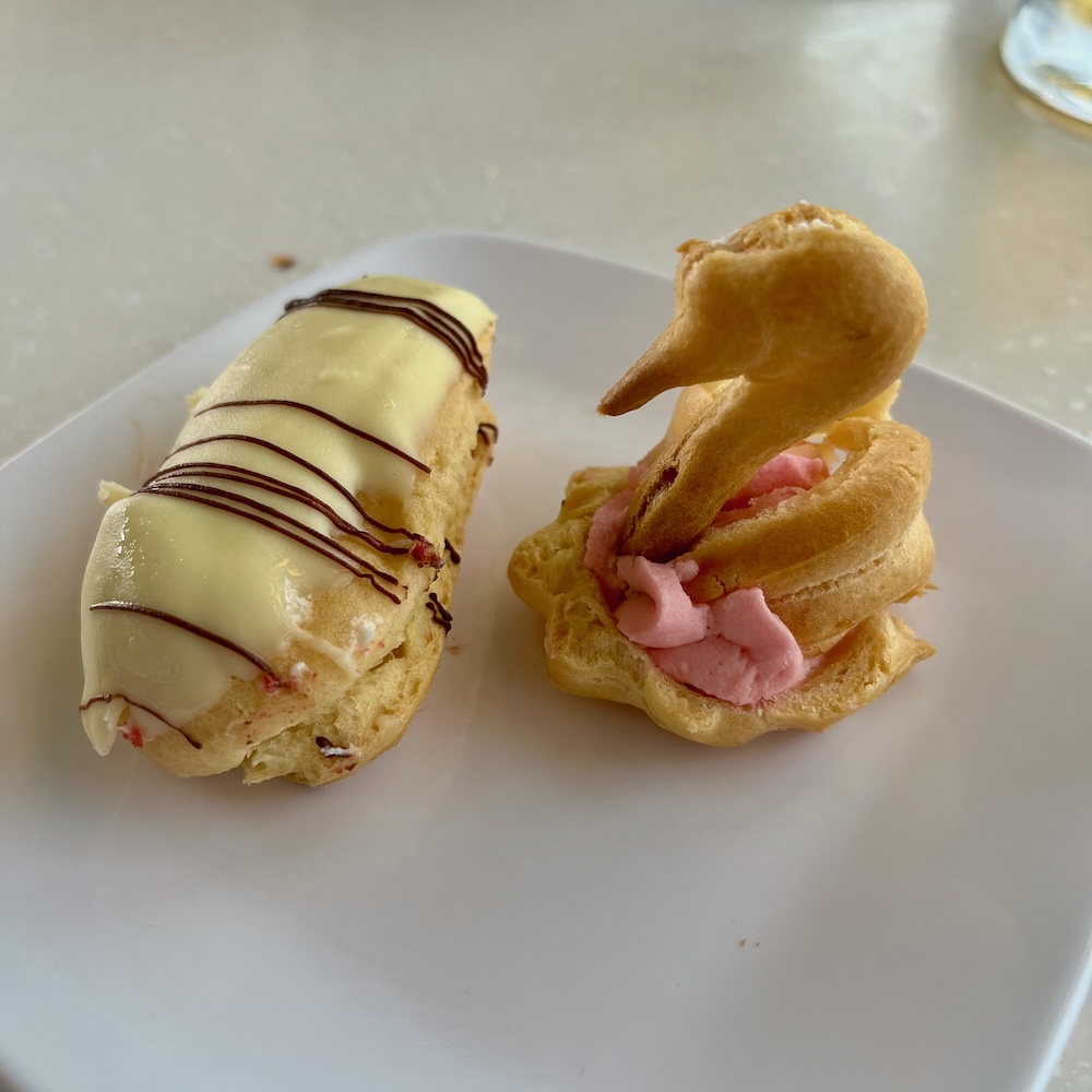 Desserts in the main dining room on the oosterdam include am eclair with a puff pastry swan.