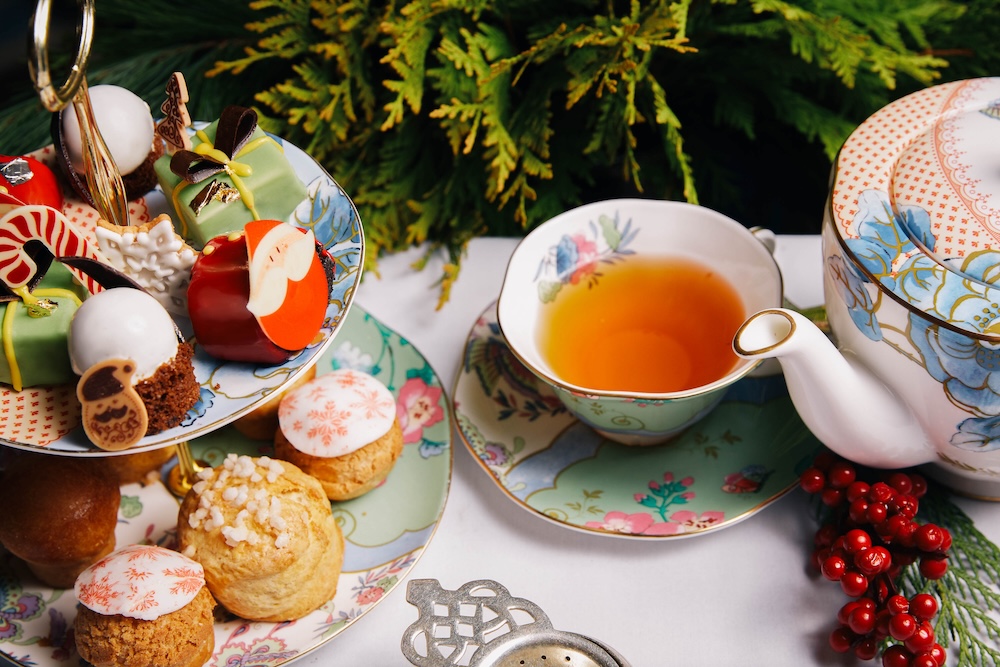 new york's peninsula hotel offers a special afternoon tea for the holidays with pastries that look like candy canes and stars and decorated with santa and snowflakes.