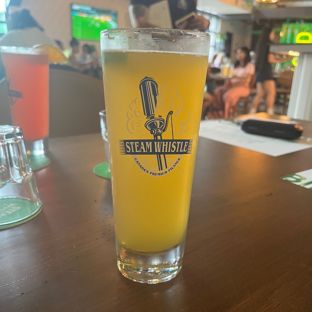 A cold shandy at the steam whistle brewing co. Mixes the house pilsner with grapefruit soda.