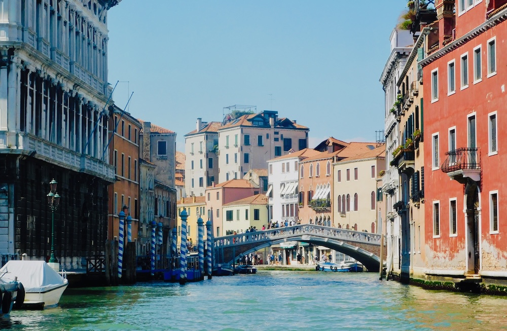 A water taxi ride down venice's grand canal gives front seat views of the rialto bridge.