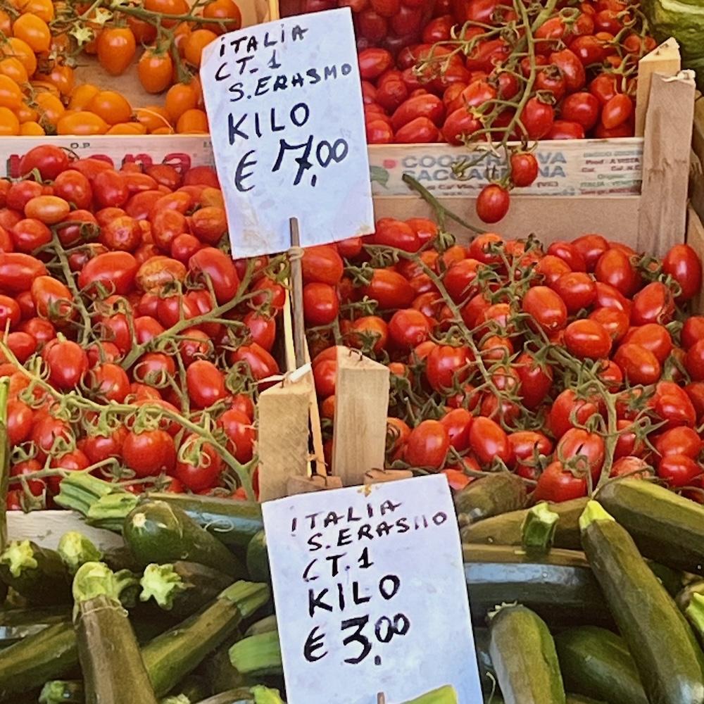 A variety of tomatoes and zucchinio a the rialto produce market.