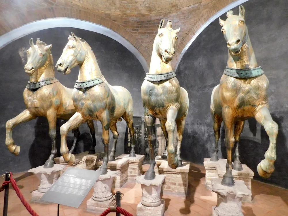 the original copper horse that guard st. mark's basilica in rome stand in the upstairs museum, protected from the elements. 