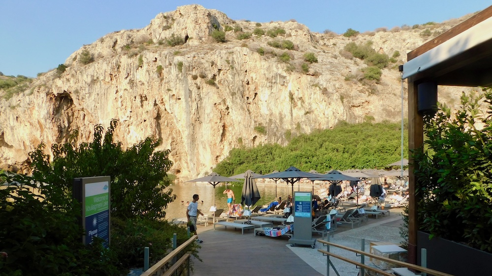 Lake vouliagmeni is a surprising retreat from the summer heat and an easy day trip with teens from athens.