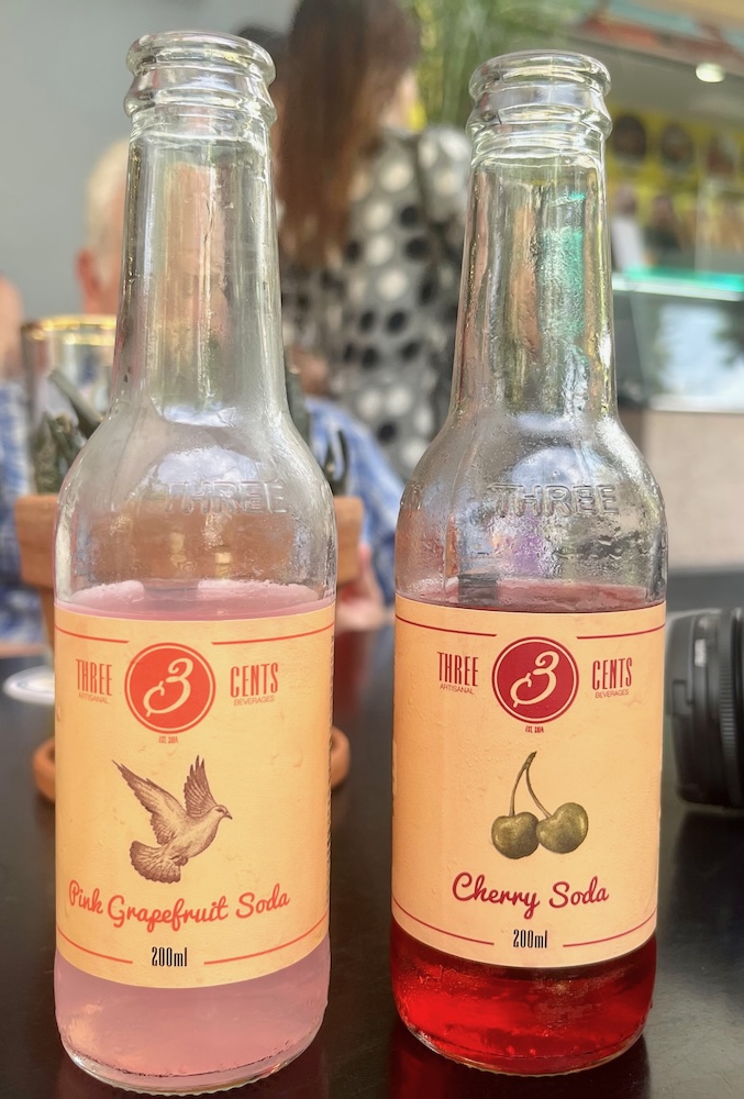 local sodas in greece are made with natural juices in fruity flavors like pink grapefruit and cherry. they're a good way to cool off on hot days. 