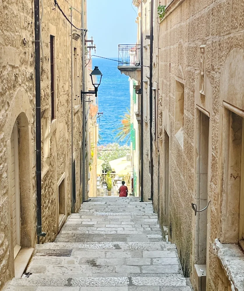 in korcula's old town, every long, slim alleyway leads to the blue adriatic sea.